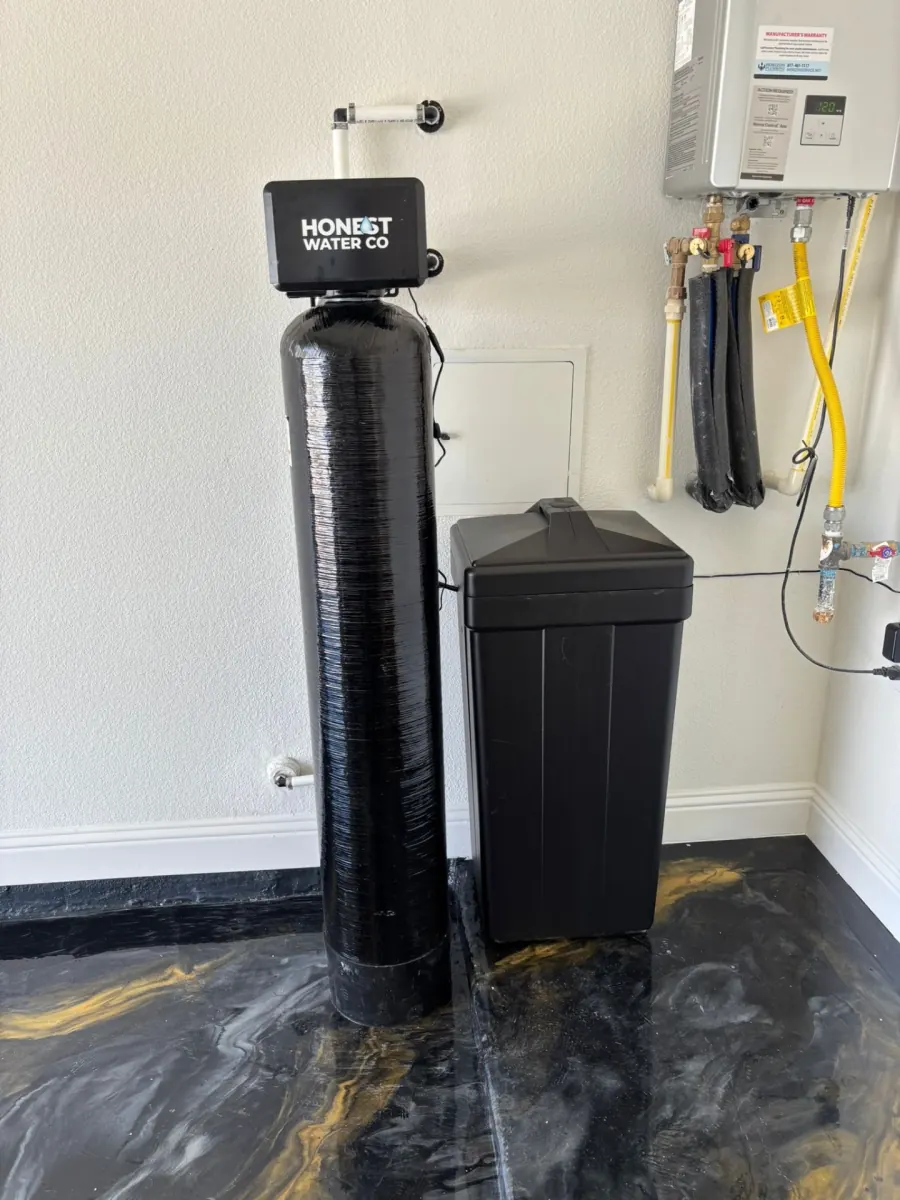 Whole-home water softener and carbon filter installed in a North Georgia garage by Honest Water Of Georgia