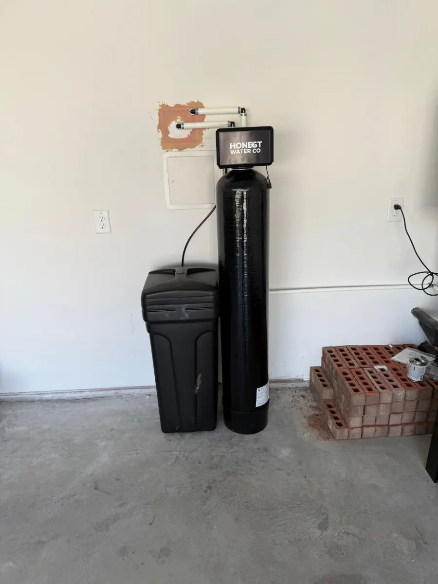 Whole-house carbon filtration tank plumbed inline with copper water lines