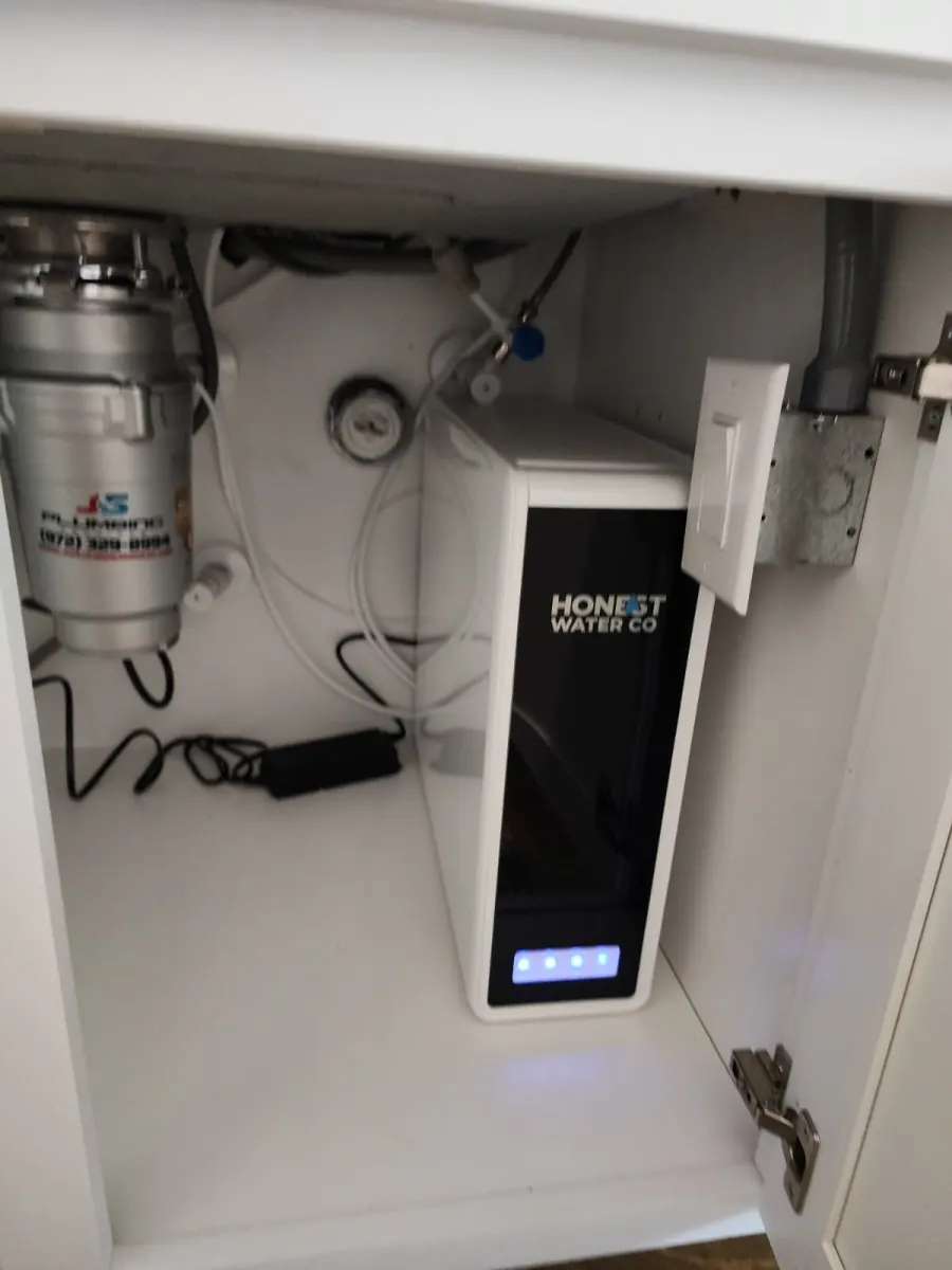 Tankless reverse osmosis unit installed in a Johns Creek kitchen cabinet
